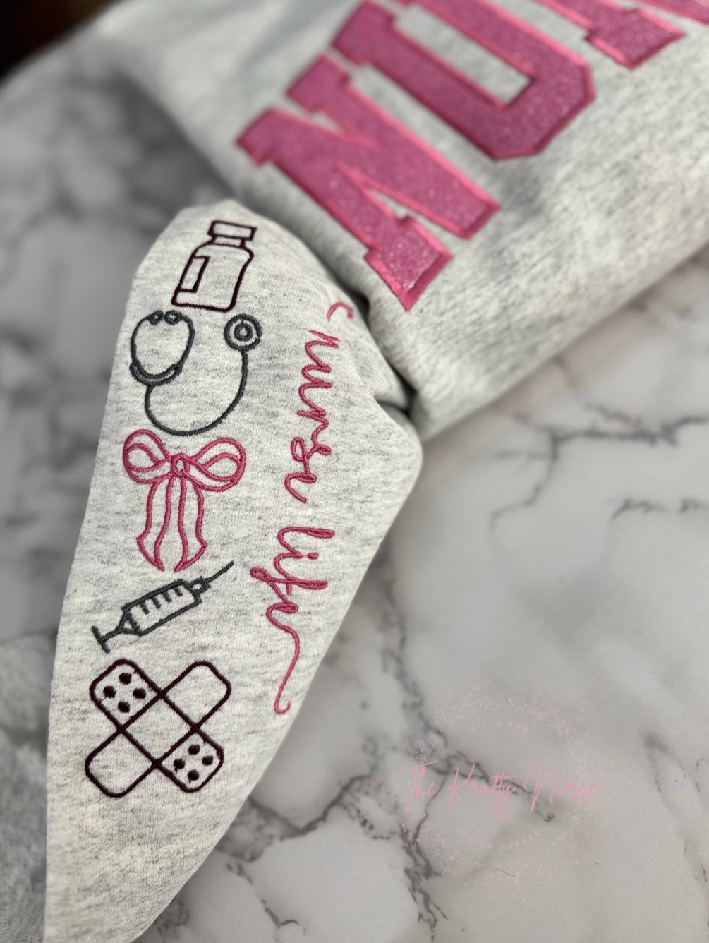 EMBROIDERED NURSE GLITTER APPLIQUÉ SWEATSHIRT